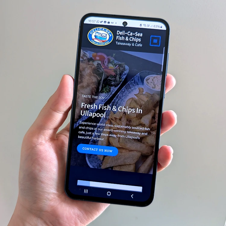 Mobile phone showing Home page of Deli-Ca-Sea Fish & Chip Shop website, Ullapool, Wester Ross